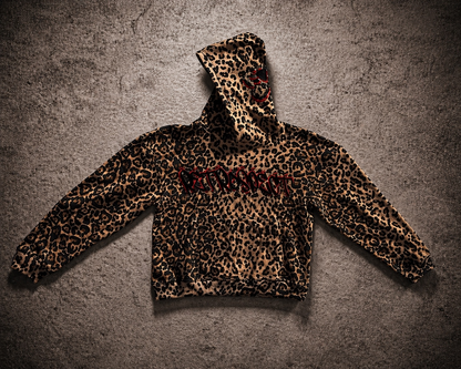 Retrospect Bejeweled Cheetah Print Hoodie featuring a colorful, jeweled cheetah pattern on soft fabric for stylish casual wear.