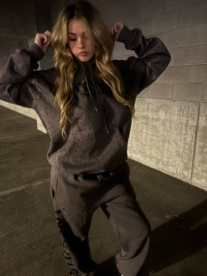 Front view of the rhinestone Retrospect Afterimage hoodie and sweats