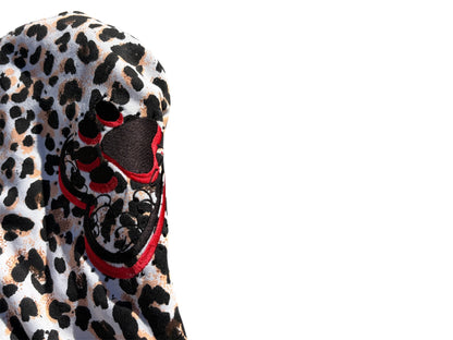 White hoodie with a bold cheetah print and bejeweled accents from RetroSpect Hoodies, showcasing a stylish animal print design.