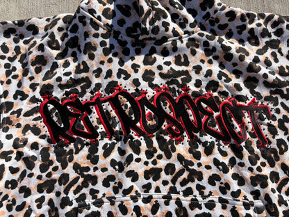 White Retrospect Bejeweled Cheetah Print Hoodie with front view, featuring sparkling embellishments and a cozy fit.